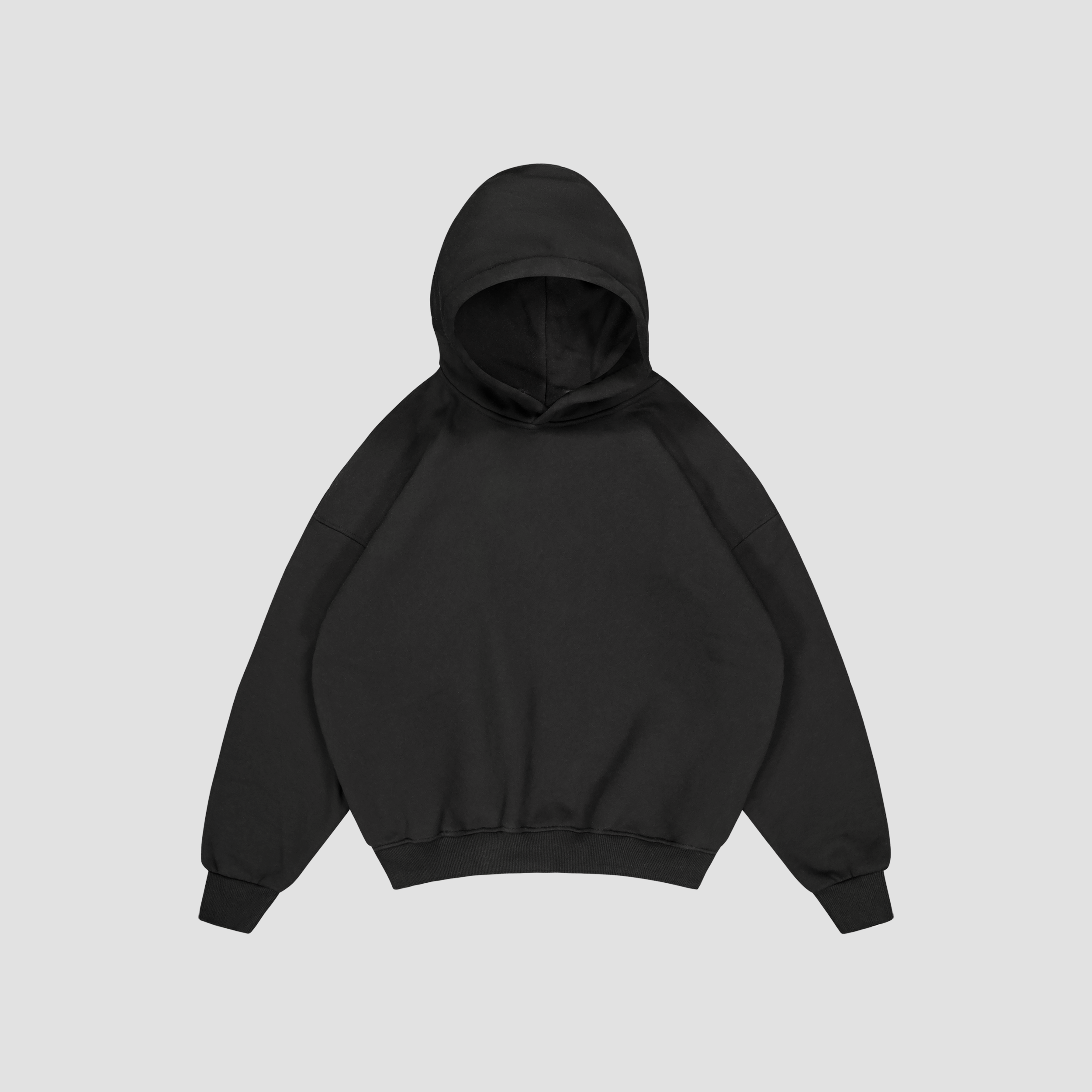 Flat Lay of Black hoodie on a light gray background