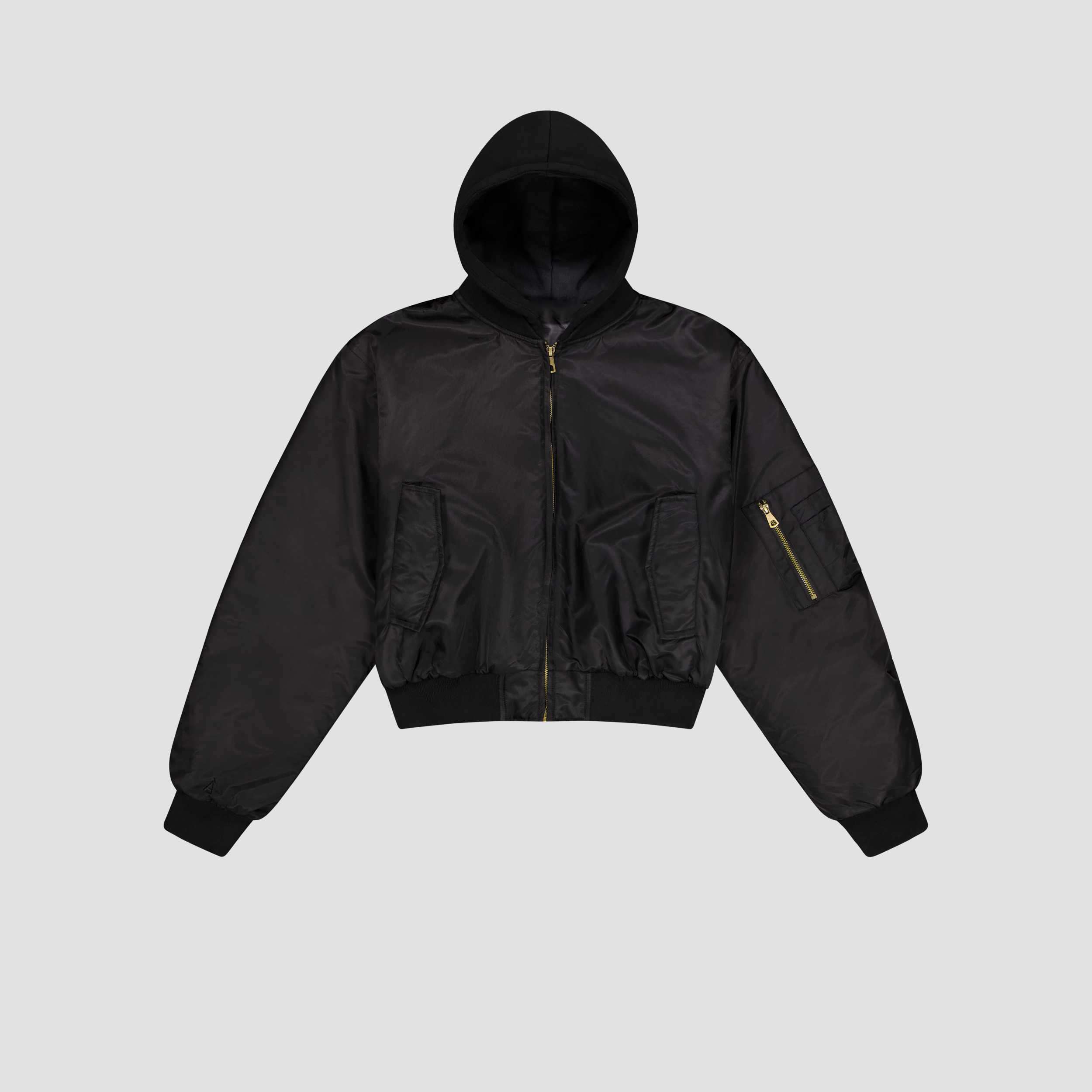 Flat Lay of Black hooded jacket on a light gray background