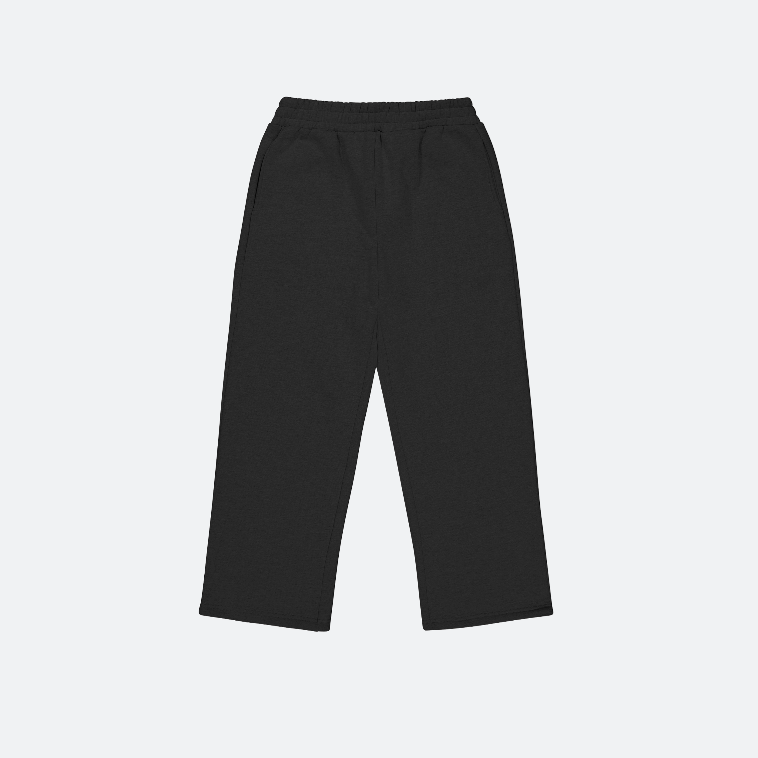 flat lay of Black track pants on a light gray background