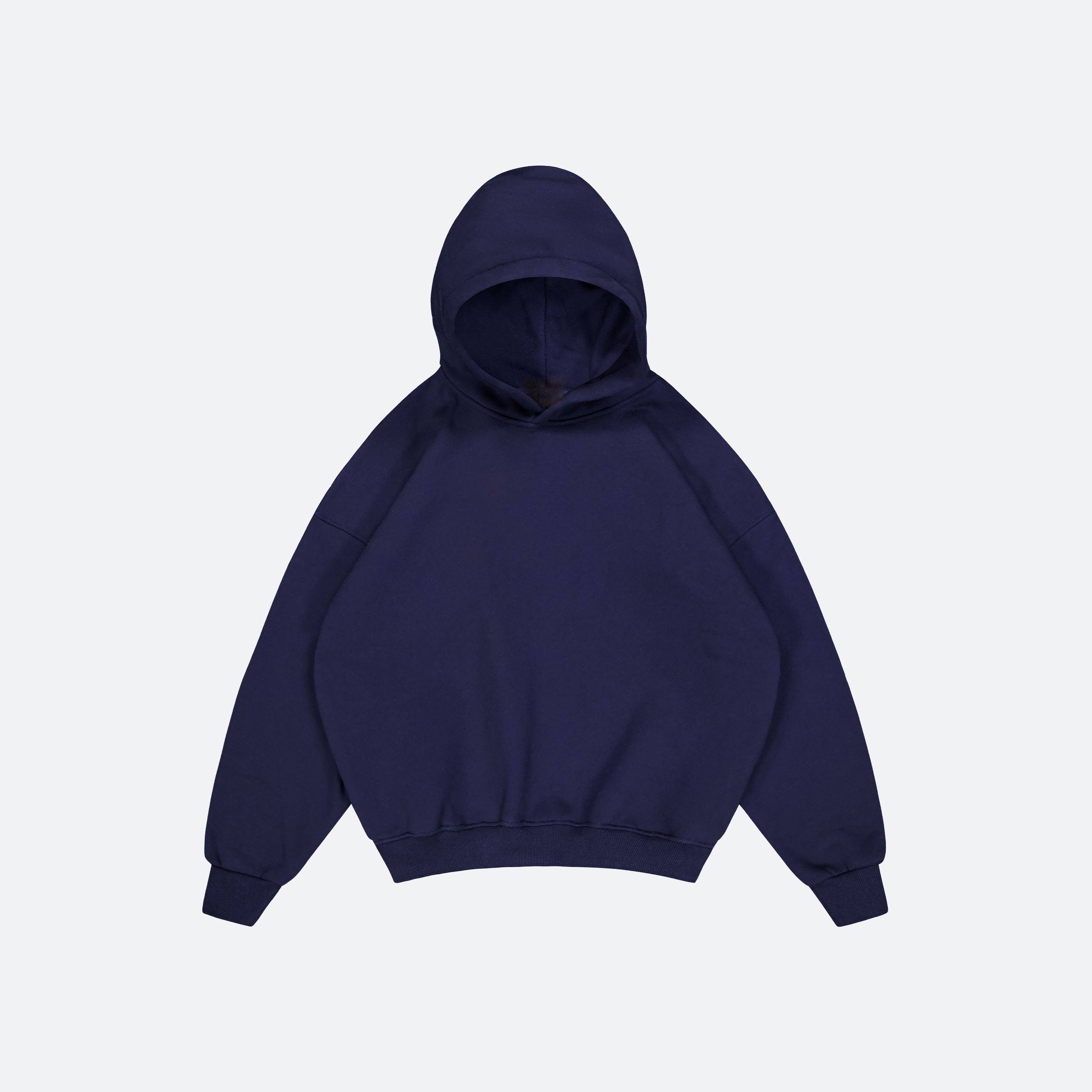 Flat Lay of Navy Heavyweight hoodie on grey background