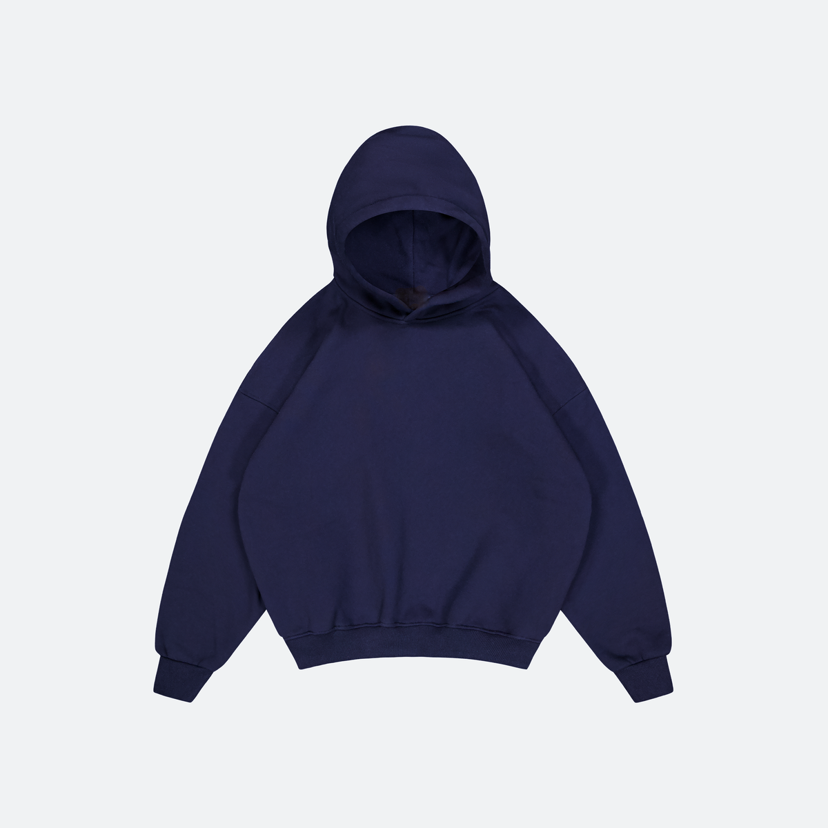 Flat Lay of Navy Heavyweight hoodie on grey background
